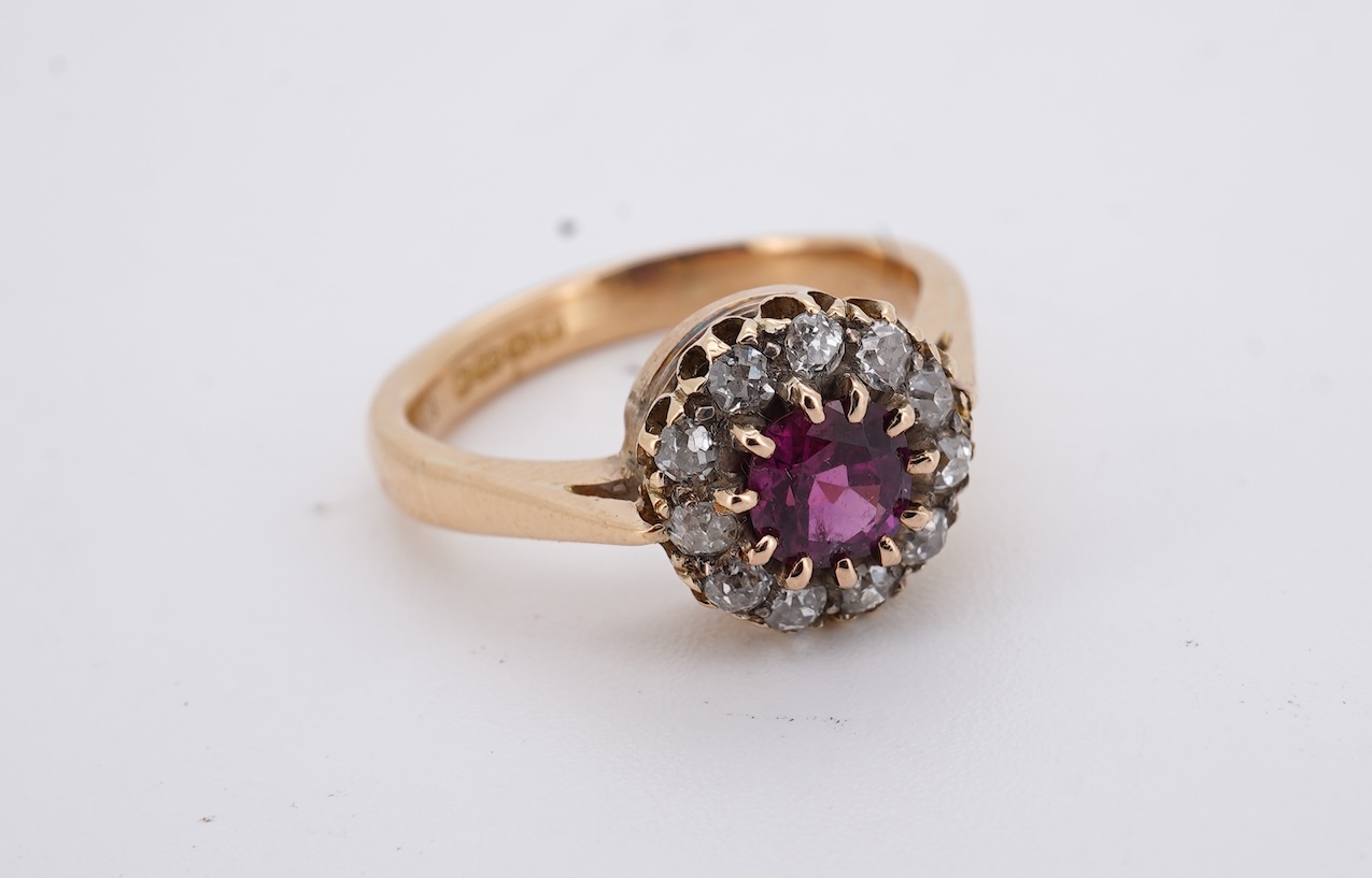 A George V 18ct gold, ruby and diamond set circular cluster ring, size M, gross weight 5 grams.